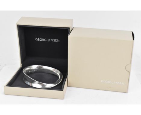 A Georg Jensen silver 'Moebius' bangle, No. 206, designed by Vivianna Torun Bulow-Hub, with box, 55.8 gramsIf there is no con
