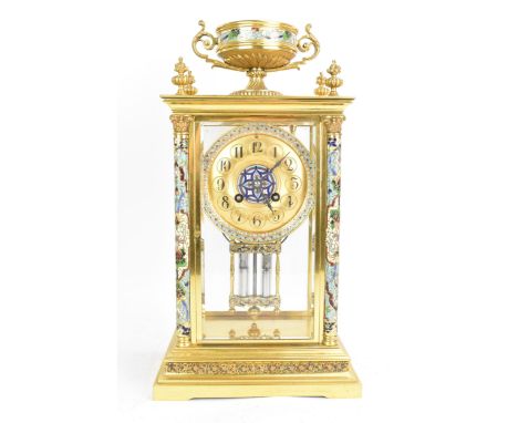 A circa 1900 French gilt metal and cloisonne mantle clock, having a twin scroll handled urn formed finial, two Corinthian clo