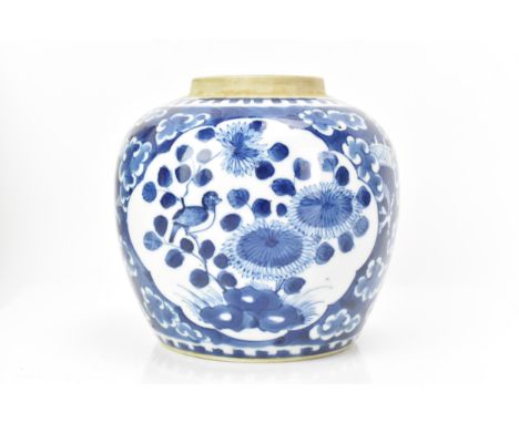 A Chinese late Qing dynasty blue and white ginger jar, late 19th century, painted with a dragon amongst clouds and with two p