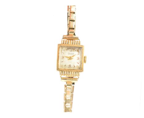 An Armida, manual wind, ladies, 9ct gold wristwatch, the square dial having baton markers and Arabic numerals, gilt hands, go