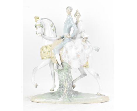 A Lladro figurine Valencians group, modelled as a courting couple on horseback sculpted by Fulgencio Garcia 4648, year issued