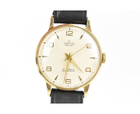 A Smiths, manual wind, gents, 9ct gold wristwatch, having a silvered dial with gilt hands, case back engraved with inscriptio