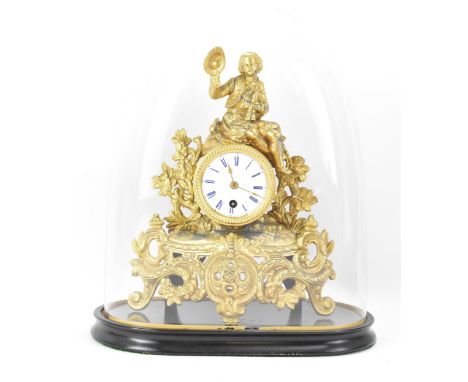 A late 19th century French gilt metal mantle clock and dome, the case fashioned as a gent seated atop the drum head clock, wi