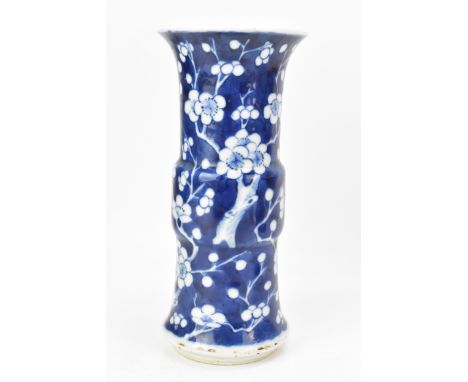 A Chinese late Qing dynasty blue and white vase, late 19th/early 20th century, in the Kangxi style in the prunus pattern, the