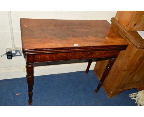 AN EARLY VICTORIAN FLAME MAHOGANY FOLD OVER CARD TABLE, the circular baize interior above turned legs (sd, losses)