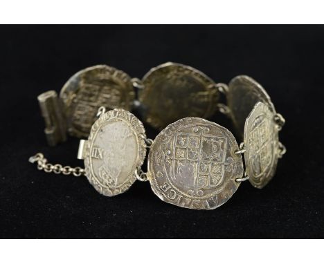 A SILVER COIN BRACELET, designed as six early English coins to the tubular bar clasp, length 180mm, weight 39.7 grams