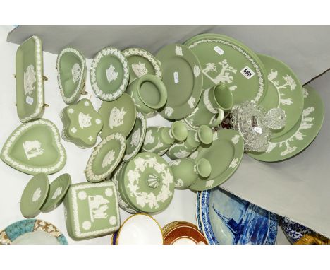 WEDGWOOD GREEN JASPER WARES to include pin trays, plates, a plaque, water jug, powder box and trinket box etc, together with 