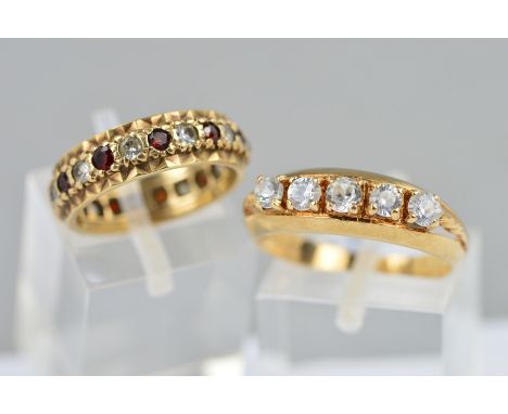 TWO DRESS RINGS, the first a 9ct gold red and colourless paste eternity ring, hallmarked Birmingham 1994, ring size K, the se