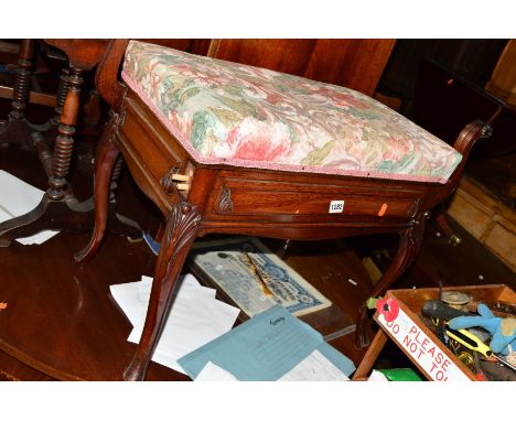 A VICTORIAN WALNUT PIANO STOOL on cabinet legs containing sheet music (sd and loose parts)