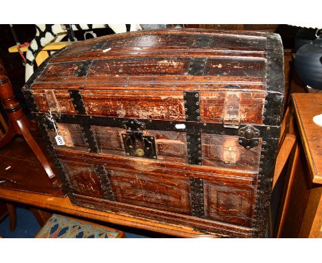 A VICTORIAN DOMED TOPPED TRUNK with wooden and metal banding, the interior revealing a single tray and decoupage detail, appr