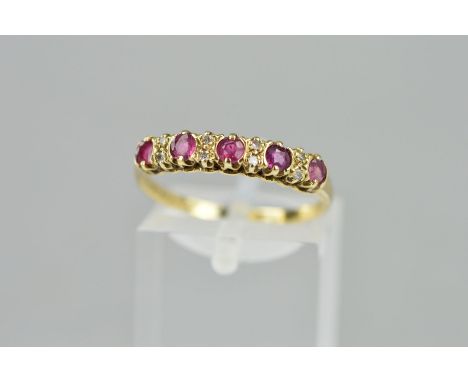 A LATE 20TH CENTURY RUBY AND DIAMOND HALF ETERNITY RING, ring size P1/2, hallmarked 9ct gold, London, approximate gross weigh