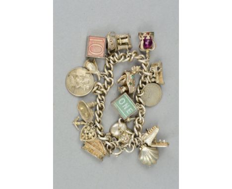 A CHARM BRACELET, the curb link bracelet suspending sixteen charms to include a hinged typewriter and hinged shell with imita