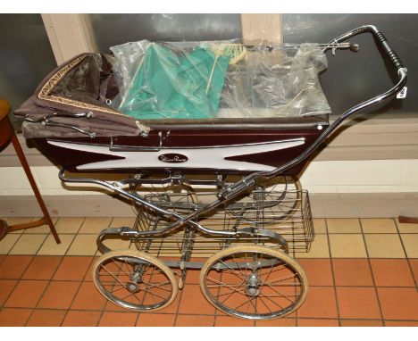 A VINTAGE SILVER CROSS PRAM