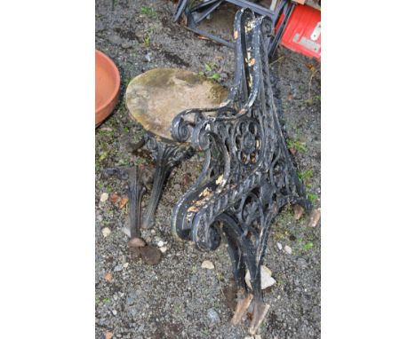 TWO CAST IRON BENCH ENDS and a cast iron legged stool (sd) (3)