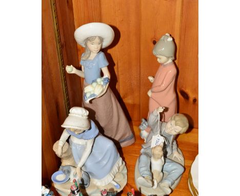 THREE NAO FIGURES OF CHILDREN, including boy with dog, girl with cat (af), girl with fruit (af), and a Zaphir girl with dog f