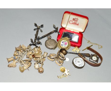 A SELECTION OF JEWELLERY, to include a silver charm bracelet suspending twenty one charms, a silver bracelet, two silver cutl