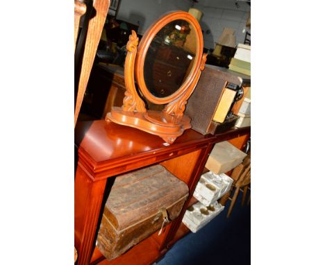 A WALNUT OVAL SWING MIRROR and a tin trunk (2)
