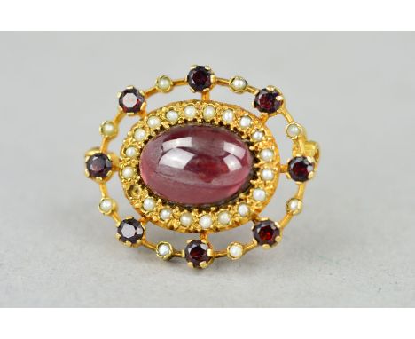 A 9CT GOLD GARNET AND SPLIT PEARL BROOCH, the central oval garnet cabochon within a split pearl surround to an outer garnet a