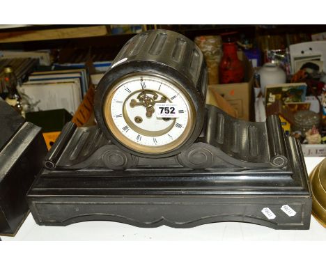 A LATE 19TH CENTURY BLACK SLATE MANTEL CLOCK, fluted drum shaped case above scrolled rectangular plinth, white enamel dial wi