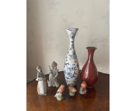 Two Lladro porcelain figurines of children with two porcelain vases and three Royal Worcester bird figures.