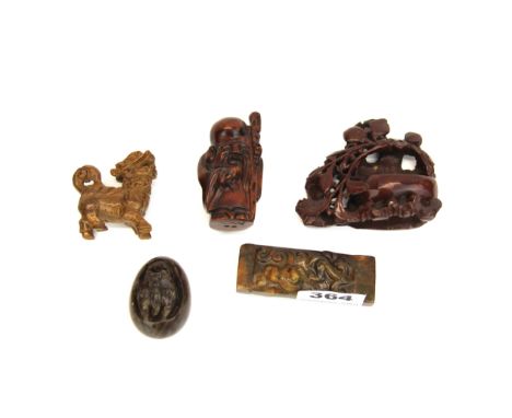 A Chinese carved double sided jade dragons scroll weight, L. 8cm. Together with a carved hardstone dragons egg, soapstone des