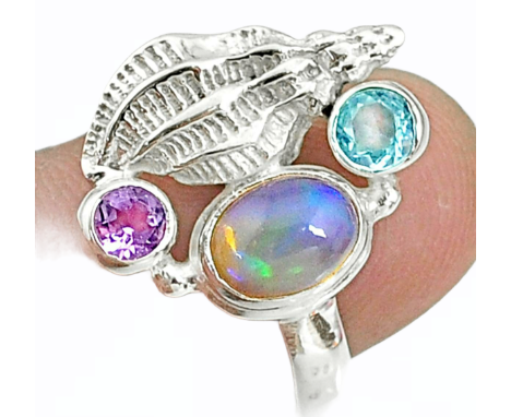 A 925 silver ring set with opal, blue topaz and amethyst, (P).