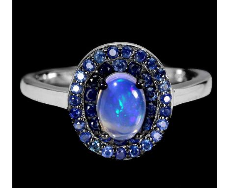 A 925 silver cluster ring set with oval cut opal and two rows of sapphires, (P).