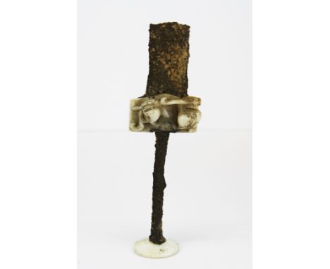 A rare Chinese archaic carved white jade decorated dagger hilt with remnants of the original iron hilt and blade, L. 18cm.