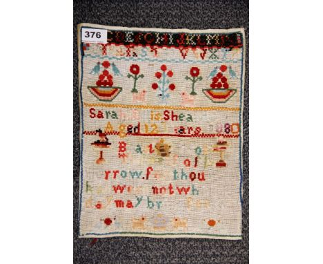 An unframed Victorian sampler dated 1880, 25 x 33cm.