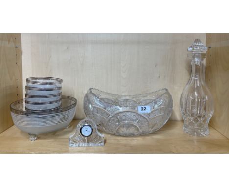 A large cut crystal fruit bowl, W.32 cm. together with a Galway crystal clock, a silvered fruit set and a cut crystal decante