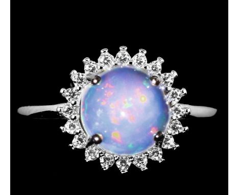 A 925 silver cluster ring set with a cabochon cut opal and white stones, (J).