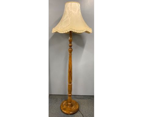 A 1930's turned wooden standard lamp, H. with shade 177cm.