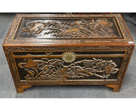 A vintage Chinese carved camphor wood lined trunk, 101 x 51 x 59cm.