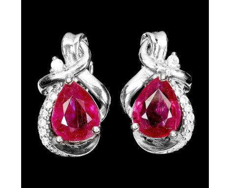 A pair of 925 silver ruby and white stone set earrings, L. 2cm.