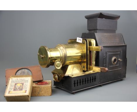 A Victorian Husband and sons brass and tin magic lantern projector with some lantern slides.