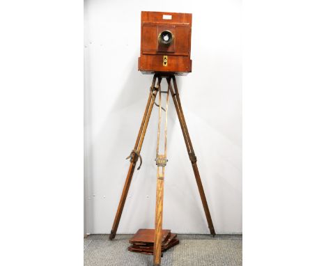 A Sands and Hunter full plate mahogany camera with brass bound portrait lens, tripod and three mahogany dark slides, 46 x 26 