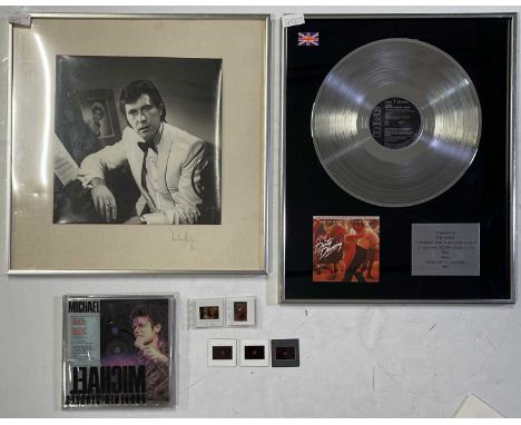 A collection of memorabilia to include a Michael Jackson souvenir singles pack, a presentation award for 'More Dirty Dancing 