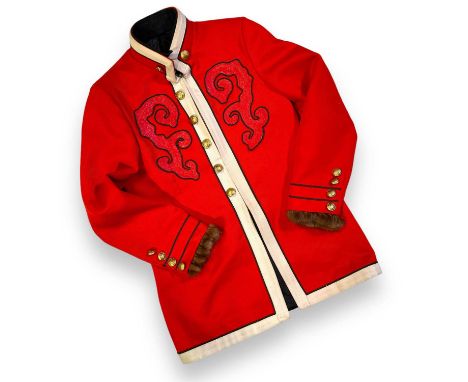 A tailored jacket, with faux fur trim to cuff, ornate and unusual pattern to back and breasts. Inscribed to lining is the dat