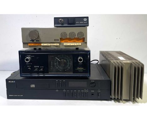 A collection of hi-fi equipment to include a Quad 303 power amplifier, a Quad 33 preamplifier, a Sansui TU-555 tuner, an Arca