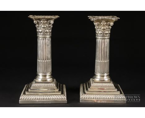 A pair of silver dwarf Corinthian column candlesticks, makers mark for William Hutton & Sons Ltd., Sheffield 1897, 15cm high 