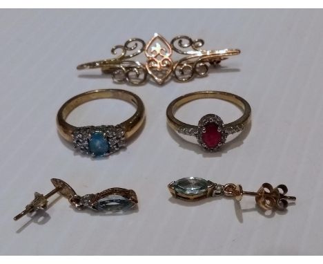 Two early 20th century 9ct yellow gold rings, one with an aqua marine stone, the other ruby-colour, sizes N, M; a 9ct gold fi