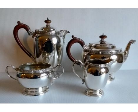 A Birmingham silver four-piece tea service with Celtic Revival decoration and Bakelite handles by Adie Brothers Ltd, 1955, 19