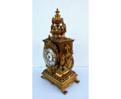 A late 19th century French gilt metal mantel clock striking on a single bell, the movement by Miller & Sons, enamelled Roman 