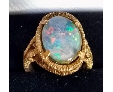 A 9ct yellow gold ring set with an oval opal, size J1/2, 5.62g