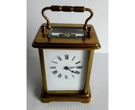 A French brass carriage clock with Roman numerals, in working order but not keeping time, 11cm H 