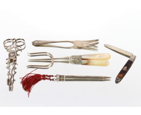 A pair of Georgian silver scissor action sugar nips; a silver bread fork with mother of pearl handle; a silver cake fork; a s