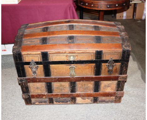 A domed metal and battened travelling trunk AF, 88cm wide x 64cm high&nbsp;