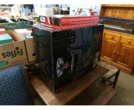 A boxed Star Wars 'First Order Special Forces Tie Fighter' and a boxed remote control Millennium Falcon (2)
