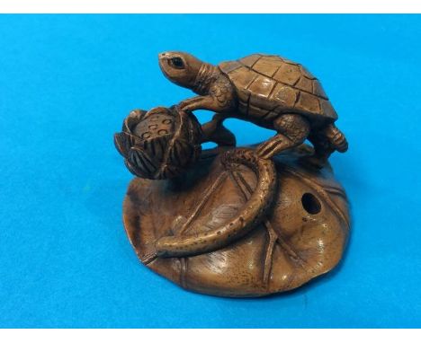 Netsuke; turtle on a lily leaf