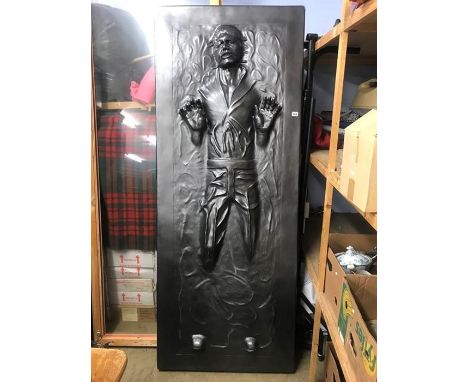 A full scale model of Han Solo frozen in carbonite (lights up and with remote control)